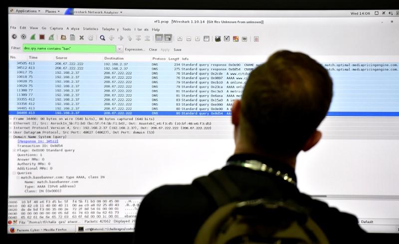 An attendee looks at a monitor at the Parsons booth during the 2016 Black Hat cyber-security conference in Las Vegas